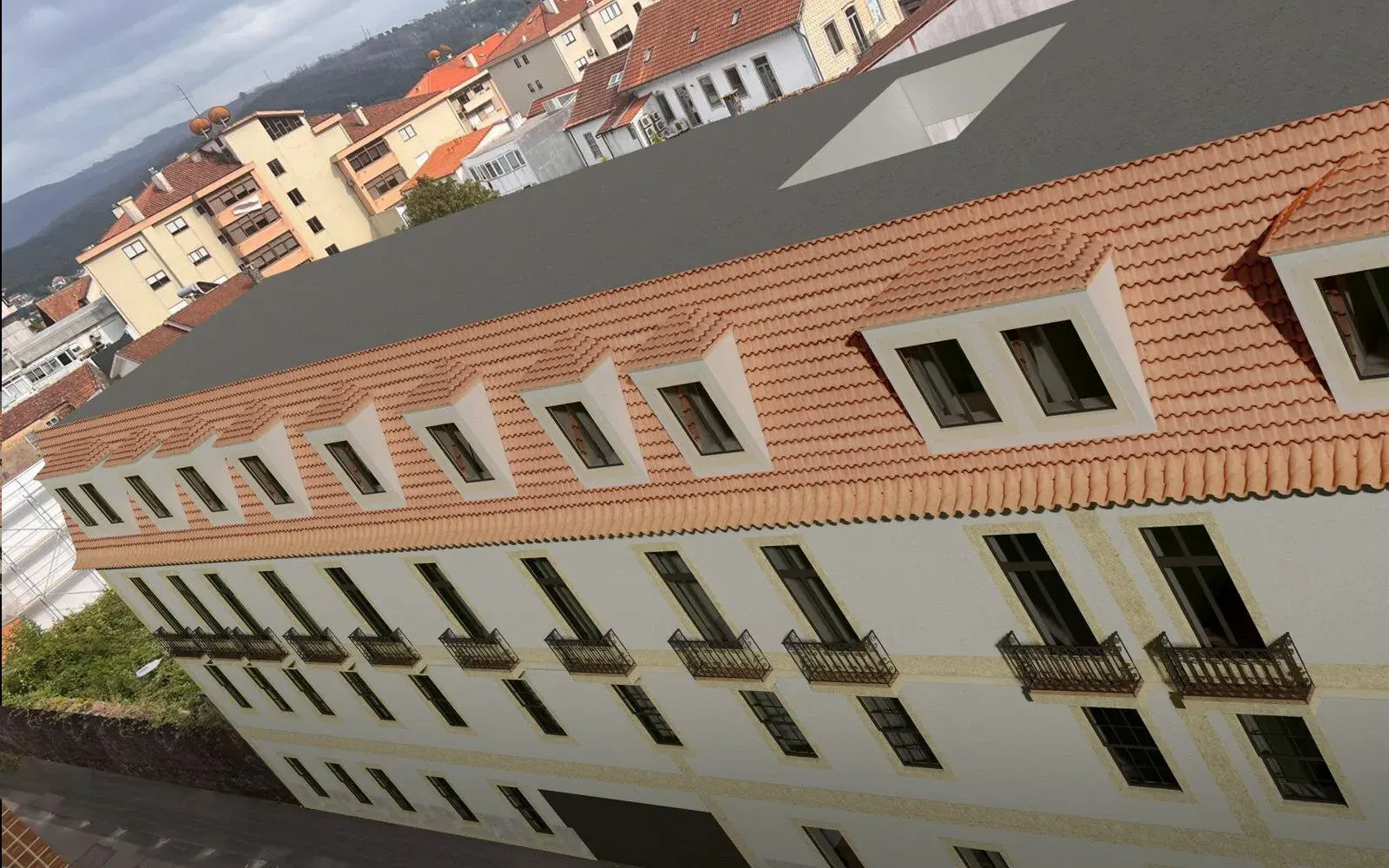 A mesma fachada depois da reabilitação, com telhado cerâmico e cantaria